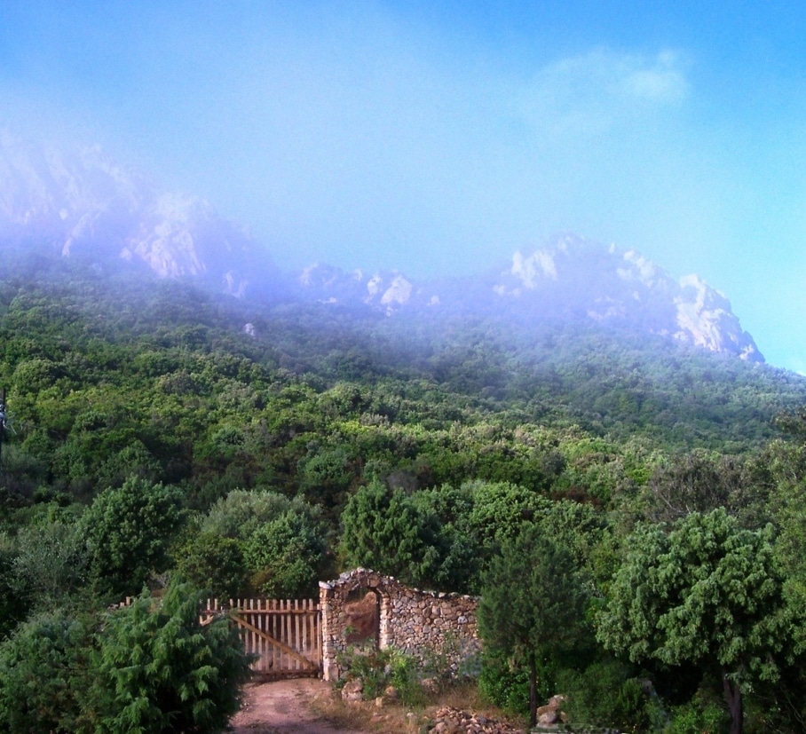 Entrance gate and mountain Cala Jami Sufi center Sardinia